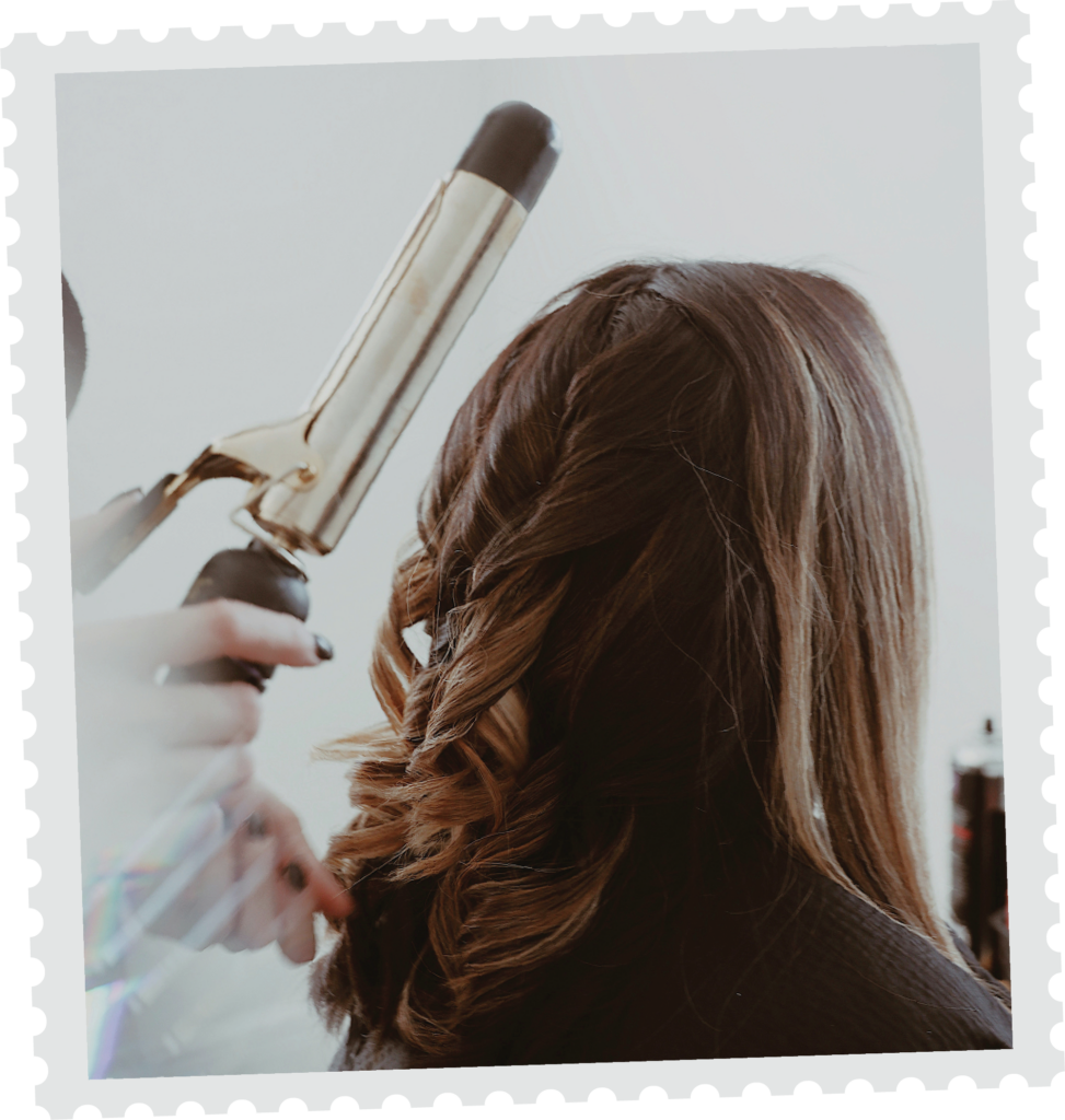 Client receiving a curled hairstyle at Precision Hair Mundaring.